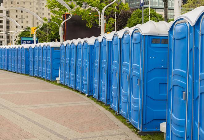 a row of portable restrooms set up for a special event, providing guests with a comfortable and sanitary option in Hill Country Village